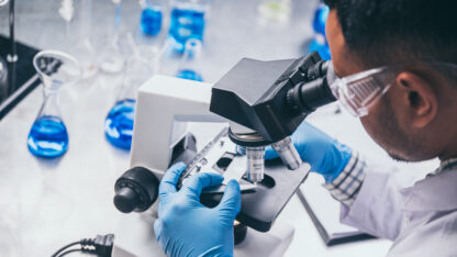 Health care researchers working in life science laboratory