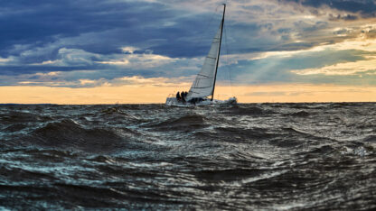 Sailboat navigating turbulent ocean
