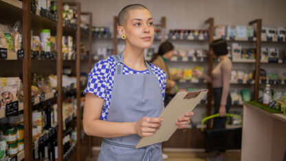 Young woman working in cannabis retail store